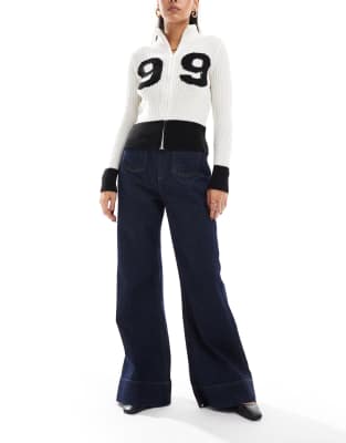ASOS DESIGN - Broek met flared pijpen en opgestikte zak in indigo