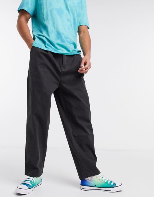 ASOS DESIGN - Broek met wijde pijpen en plooien in zwart met wassing