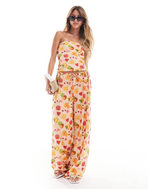 ASOS DESIGN - Broek met wijde pijpen, textuur en fruitprint in oranje
