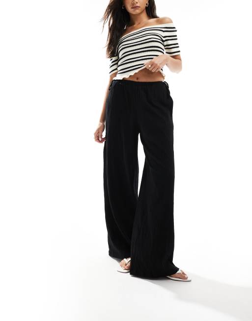ASOS DESIGN - Broek met wijde pijpen, textuur en gestrikte zijkant in zwart