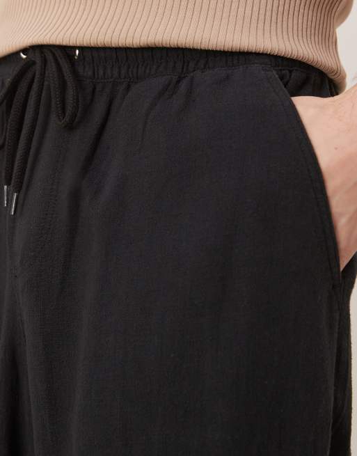 ASOS DESIGN - Broek van linnenmix met baggy pasvorm en elastische taille in zwart, 4 van 5