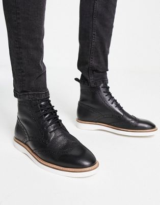 ASOS DESIGN brogue lace up boots in black leather with white wedge sole