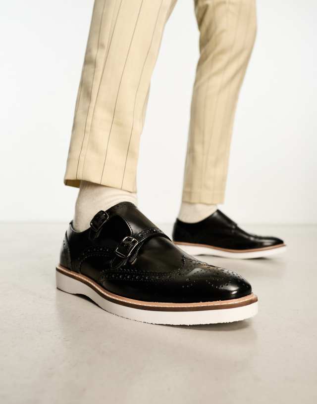 ASOS DESIGN brogue monk shoes in black leather with white wedge sole