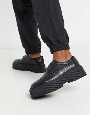 asos design trainer shoes in black leather with chunky sole