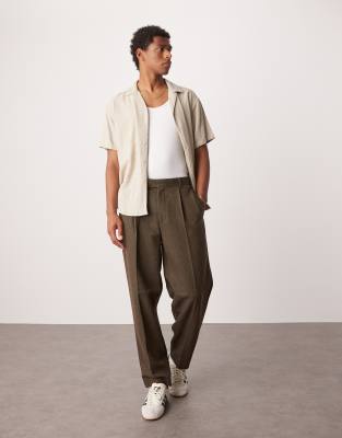 ASOS DESIGN – Bruna, avsmalnande finbyxor i oversize och ylletwill med veck - view 1