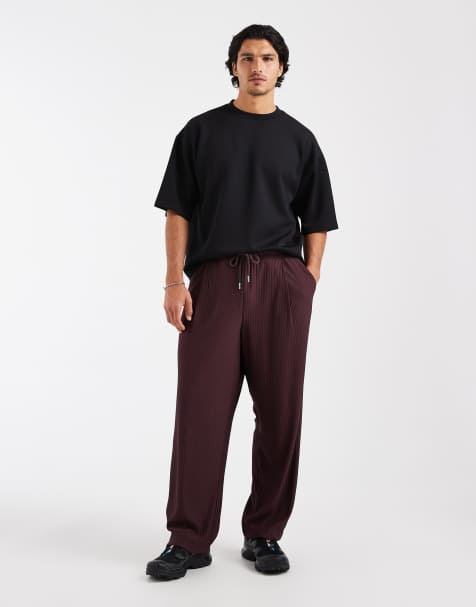 ASOS DESIGN - Brune afslappede joggingbukser i tapered fit med plisseringer - view 1