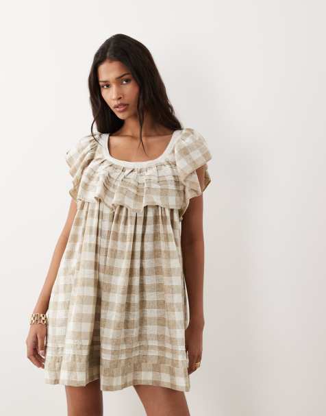 ASOS DESIGN – Brunrutig smockklänning i minilängd med djup halsringning och volanger - view 1
