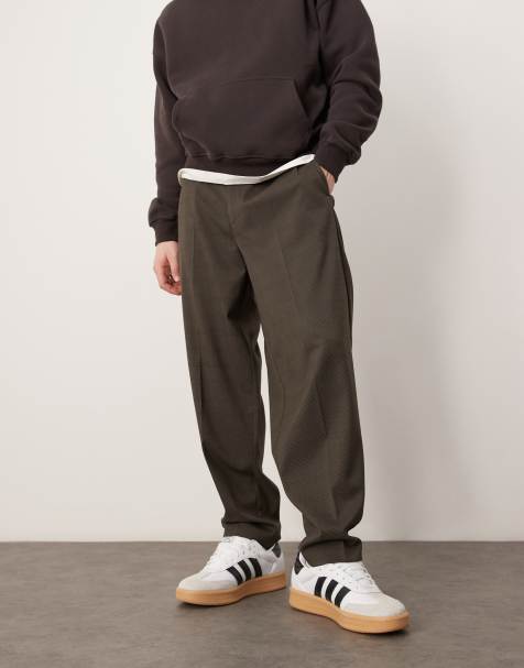 ASOS DESIGN – Brunrutiga, avsmalnande finbyxor i oversize med elastisk linning - view 1