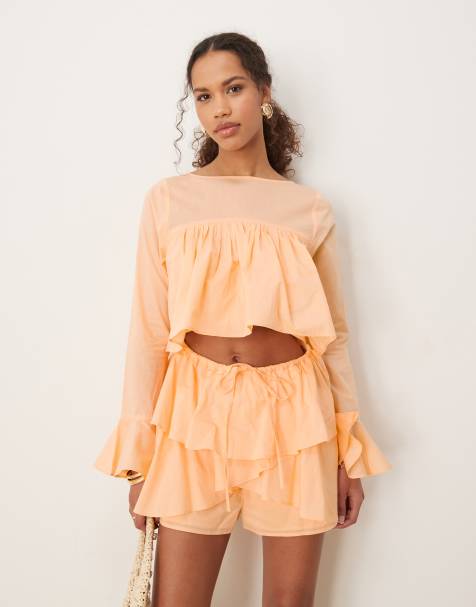 ASOS DESIGN cotton ruffle cutout playsuit in peach