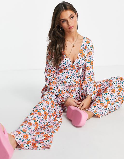 ASOS DESIGN bubble crepe button back long sleeve jumpsuit in floral print