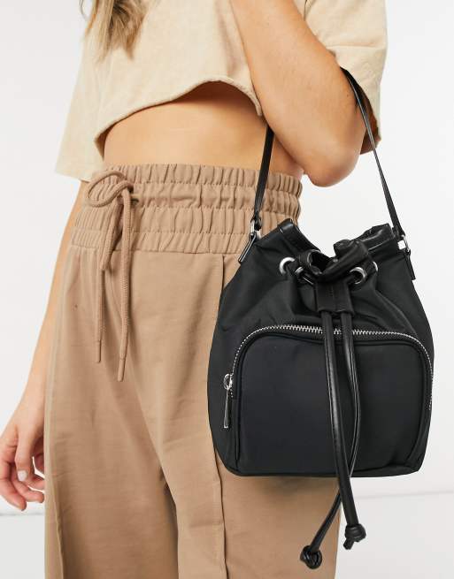 ASOS DESIGN bucket bag with front pocket in black nylon