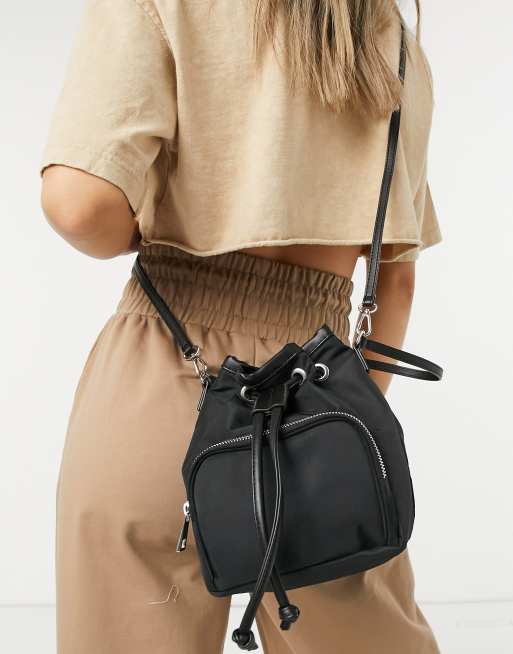 ASOS DESIGN bucket bag with front pocket in black nylon