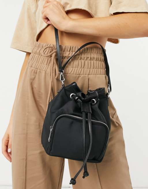 ASOS DESIGN bucket bag with front pocket in black nylon