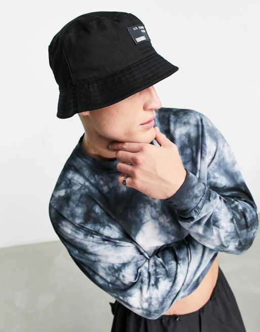 ASOS DESIGN bucket hat in black cotton with branded logo | ASOS