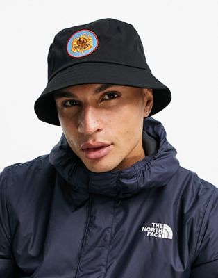 ASOS DESIGN bucket hat in black with 70's lion embroidery