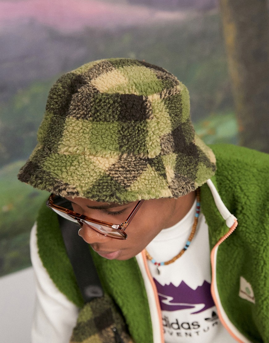 ASOS DESIGN bucket hat in green borg with plaid design