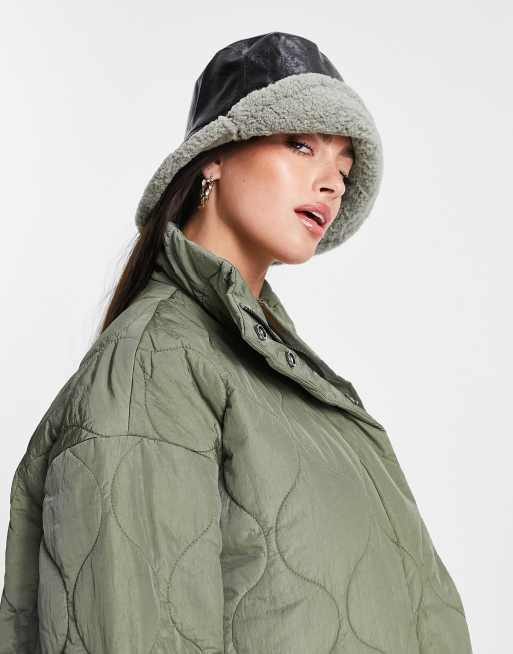 ASOS DESIGN bucket hat in PU with contrast shearling turn up in multi