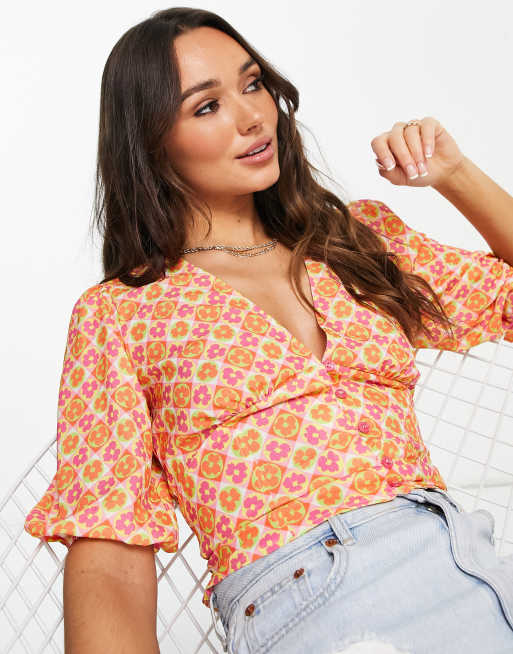 ASOS DESIGN button front tea blouse with volume sleeve and tie back detail in bright tile print
