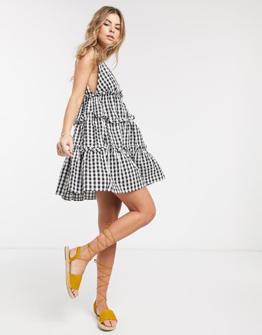 ASOS DESIGN button front tiered mini sundress in gingham seersucker