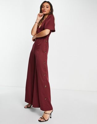 ASOS DESIGN button side batwing jumpsuit in berry | ASOS