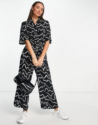 ASOS DESIGN button through jumpsuit in abstract print