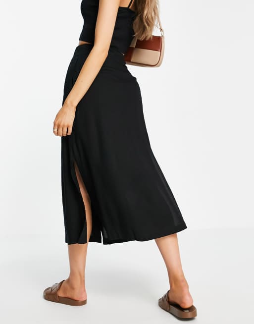 ASOS DESIGN button through midi skirt with deep pocket detail in black, 2 of 4