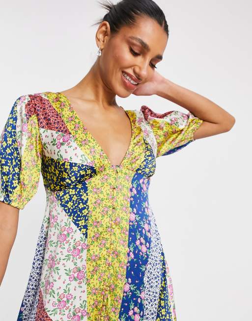 asos design midi tea dress with buttons in floral print ASOS DESIGN midi tea dress with buttons in floral print