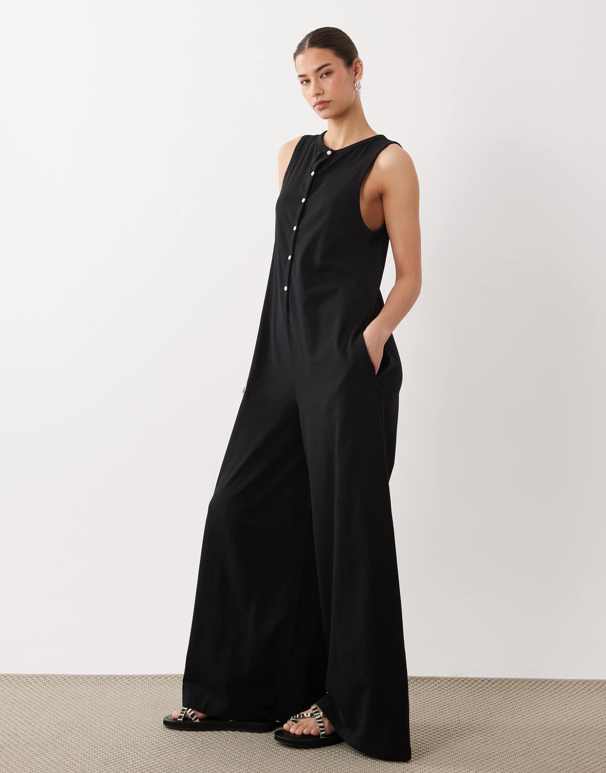 asos design button up jumpsuit with pockets in black