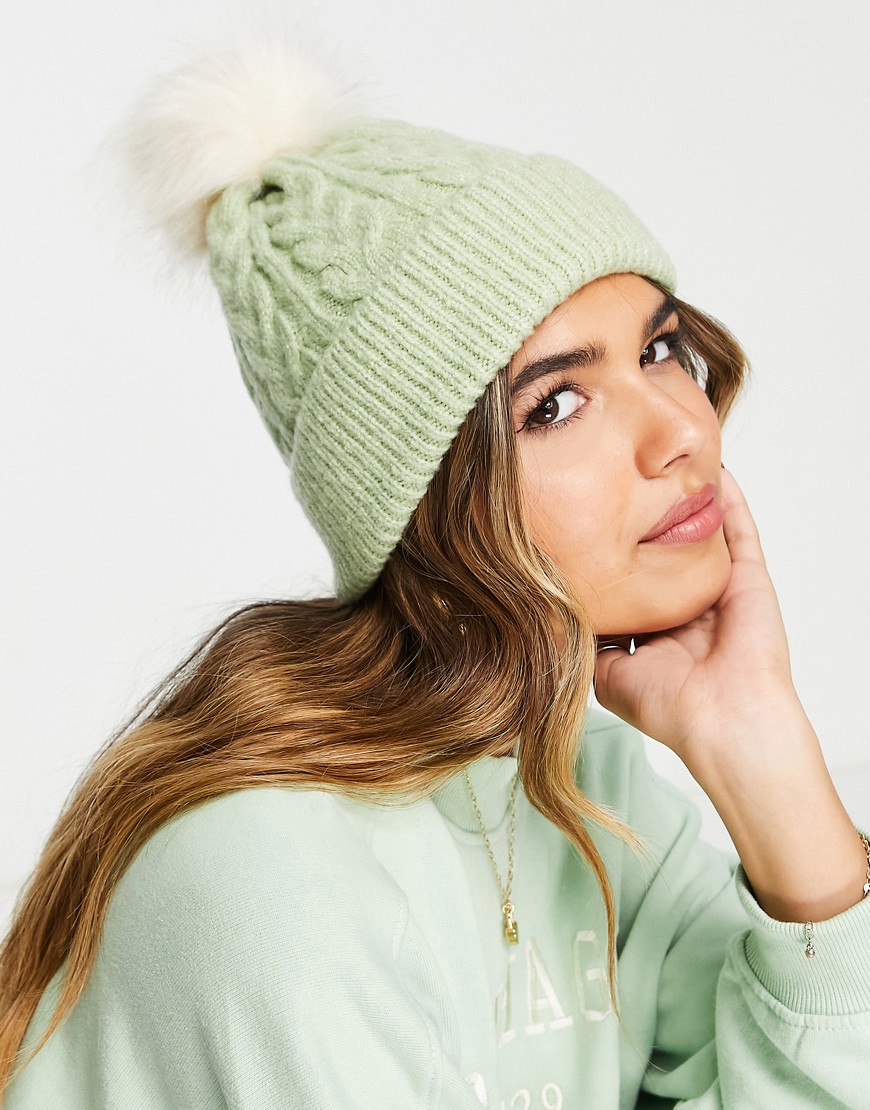 ASOS DESIGN cable knit beanie with faux fur pom in sage-Green