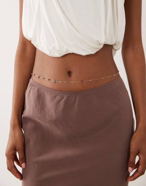 ASOS DESIGN - Cadena para el vientre dorada con fragmentos de piedras de colores intercaladas