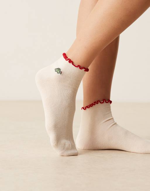 ASOS DESIGN - calcetines crema con dinosaurio bordado y borde de volante, 2 de 3