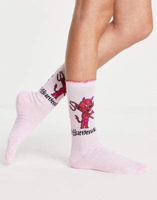 ASOS DESIGN frill top socks with heartbreaker motif in pink