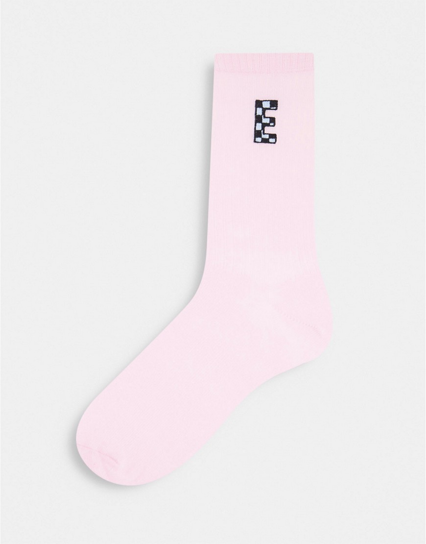 ASOS DESIGN calf length rib socks with E initial in pink