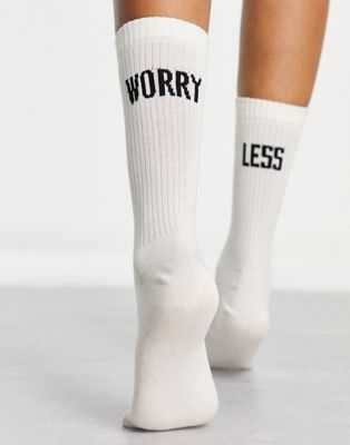 ASOS DESIGN  socks with worry less slogan in off white - WHITE