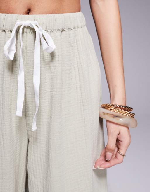 ASOS DESIGN – Callie – Beach-Hose aus Musselin in verwaschenem Salbeigrün mit Fransen, 3 von 5