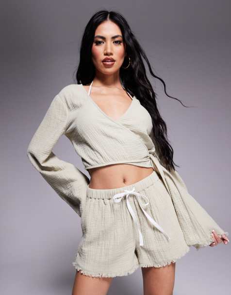 ASOS DESIGN – Callie – Blekt salviagröna strandshorts med fransig fåll i tunn väv - view 1