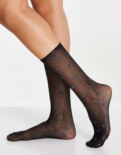 ASOS DESIGN - Calzini al polpaccio trasparenti neri con stampa glitterata di stelle
