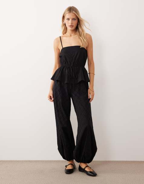 ASOS DESIGN cami peplum waist jumpsuit with embroidered pants in black - view 1