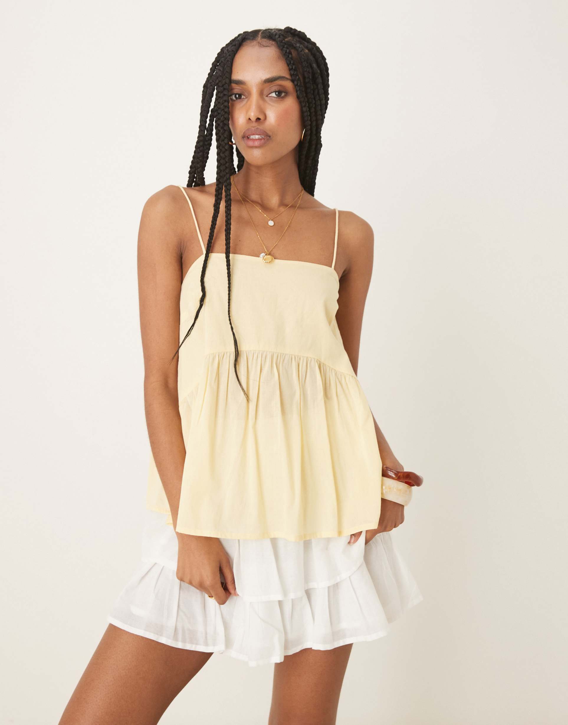 asos design cami with volume peplum and tie straps in yellow