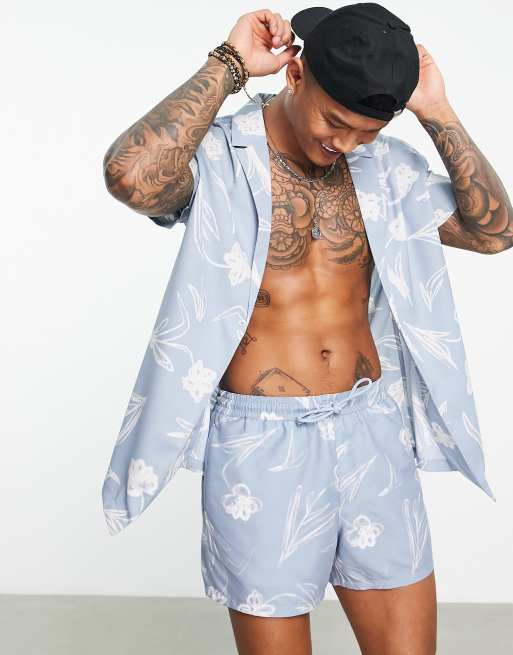ASOS DESIGN - Camicia comoda blu a fiori con rever e bottone in coordinato