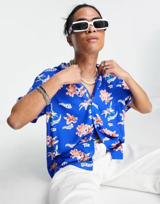 ASOS DESIGN - Camicia comoda blu acceso con stampa a fiori e rever