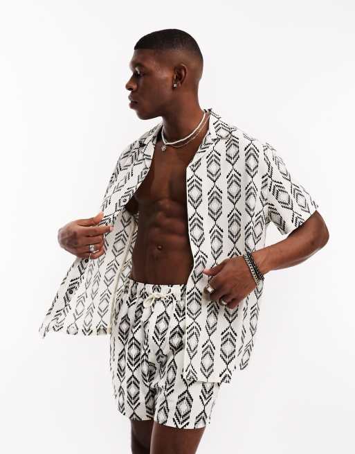 ASOS DESIGN - Camicia con rever vestibilità comoda con stampa azteca in coordinato