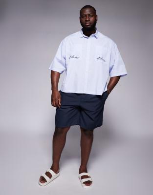 ASOS DESIGN boxy oversized shirt in blue and white micro check with pocket embroidery