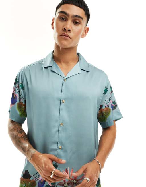 ASOS DESIGN - Camicia vestibilità comoda con stampa floreale sui bordi e colletto a rever 