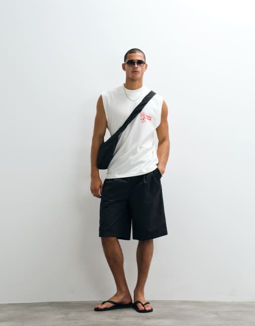 ASOS DESIGN - Camiseta color crema extragrande sin mangas con estampado gráfico de carpa, 2 de 5