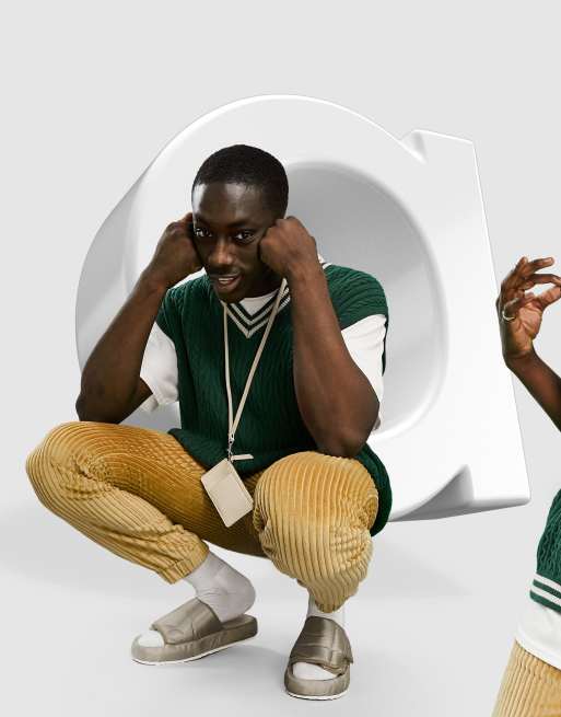 ASOS DESIGN - Canotta stile cricket lavorata a maglia verde bottiglia con bordi a righe a contrasto