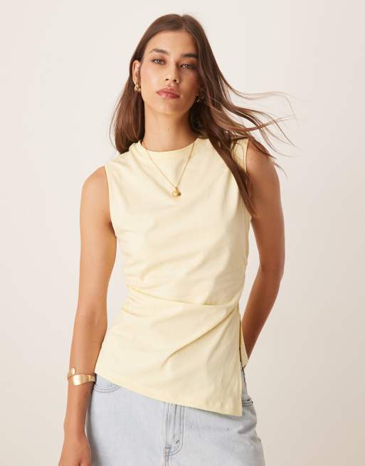 ASOS DESIGN - Canotta stretta in vita con orlo asimmetrico color limone