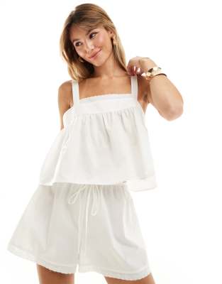 ASOS DESIGN - Canottiera bianca in cotone con finiture in pizzo | ASOS