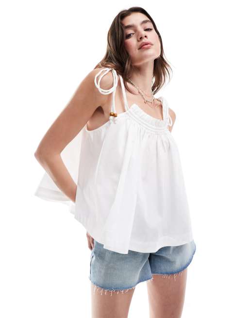 ASOS DESIGN - Canottiera svasata in cotone bianca con spalline allacciate e perline