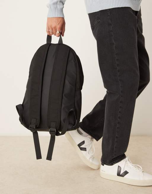 ASOS DESIGN canvas backpack with faux leather base in black